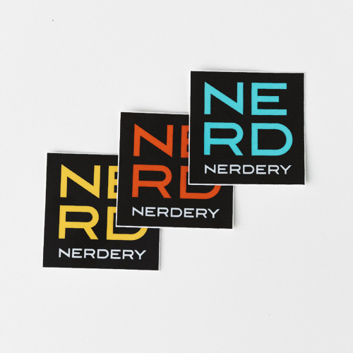 NERD Nerdery branded logo stickers in the three brand colors.